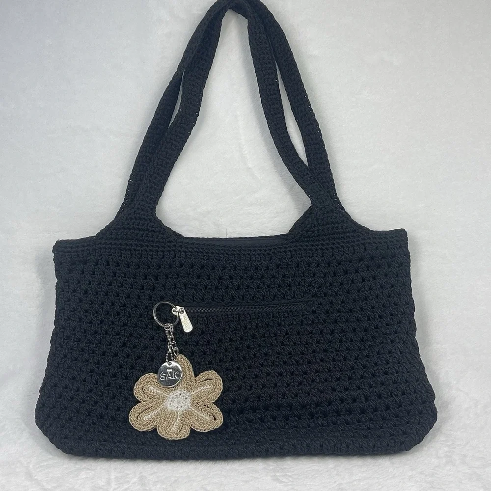The Sak Black Crochet Shoulder Bag Boho Knit Purse Charm Flower NWOT